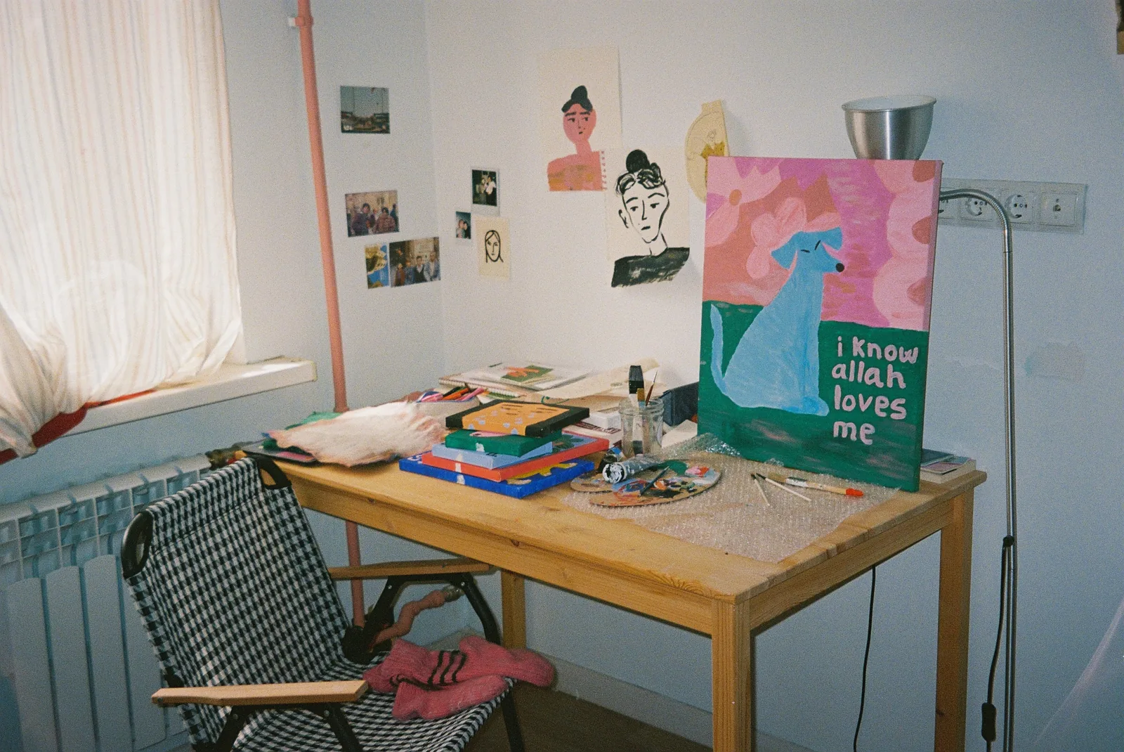 Paintings, drawings and art materials in sima omarkulova’s studio