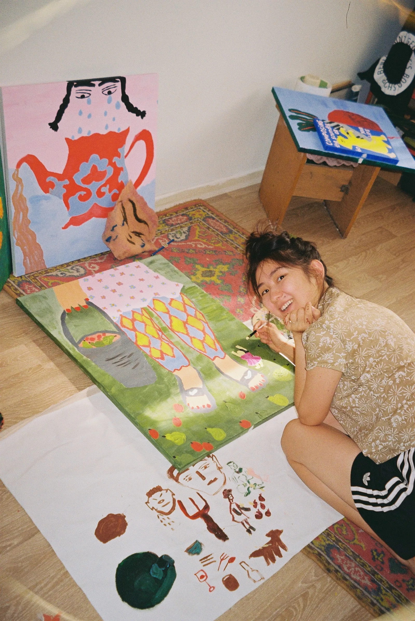 sima painting on the studio floor